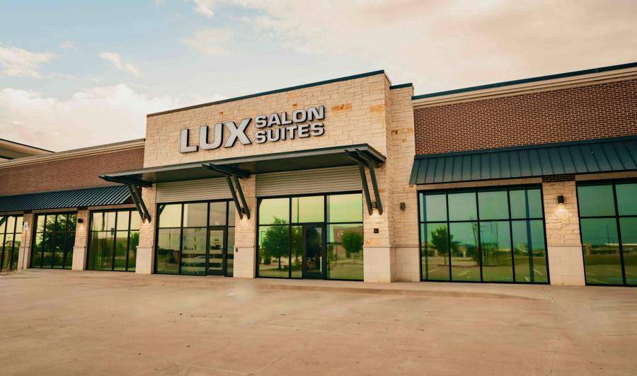 LUX Salon Suites storefront at 2281 E. University Drive in Prosper, Texas at dusk