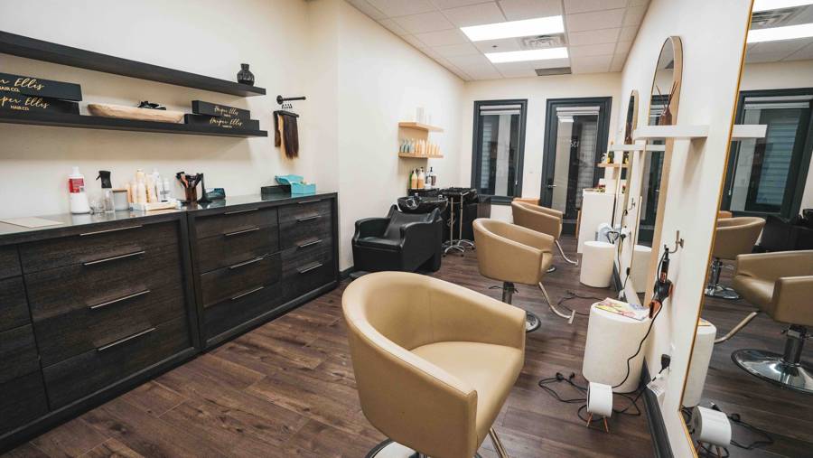 Spacious two-chair salon suite with shampoo bowl at LUX Salon Suites